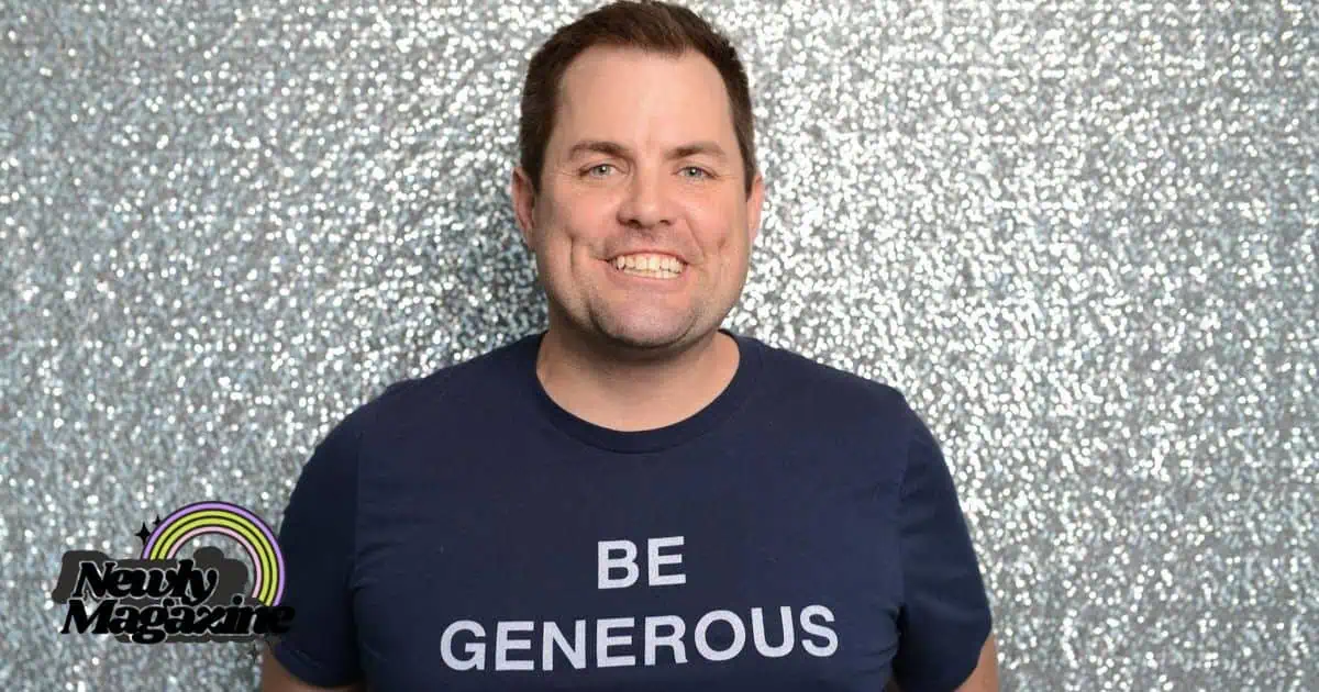 A man in a t-shirt reading "Be Generous," symbolizing the spirit of giving, associated with Kris Lindahl Net Worth.