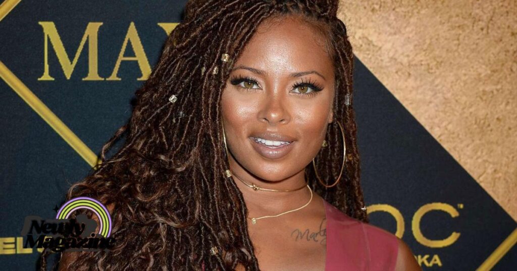 A woman with dreadlocks wearing a red dress, embodying the essence of style and grace. Who Are Eva Marcille’s Siblings?