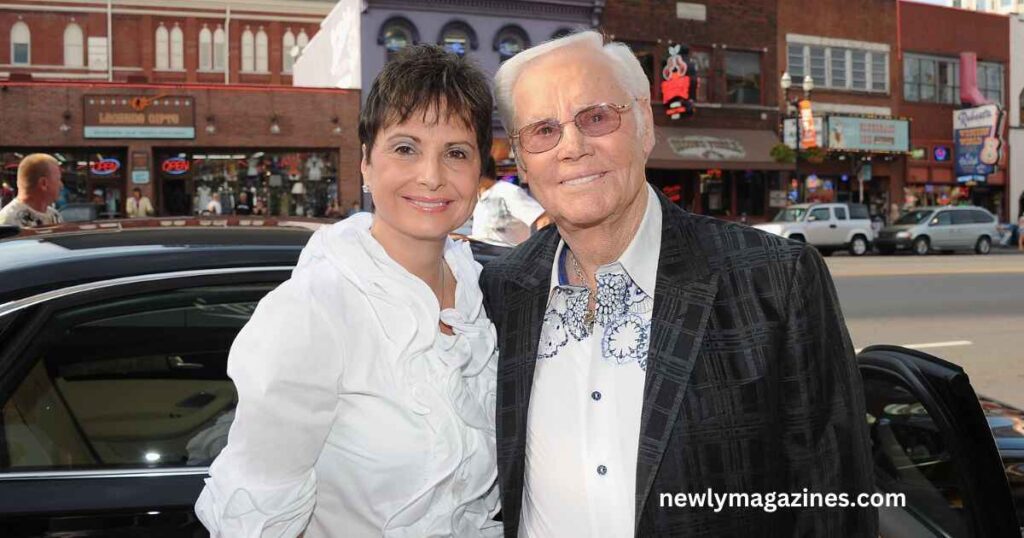 An older man and woman stand proudly in front of a car, representing the Georgete Jones family information