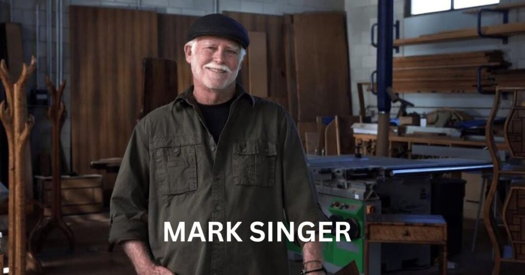 Mark Singer in his workshop, showcasing his craftsmanship and dedication to his art. Who is Mark Singer?