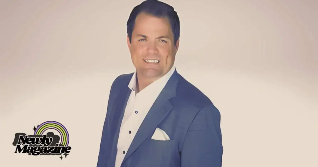 A man in a suit and tie smiling, representing Kris Lindahl's personal life and professional demeanor.